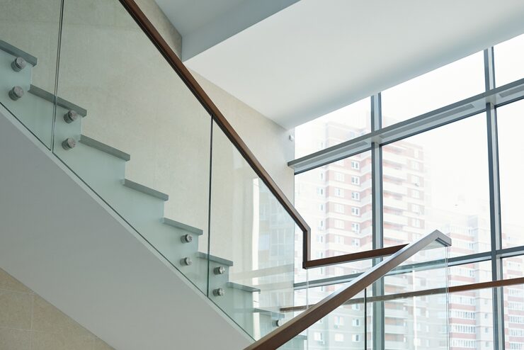 part-staircase-with-railings-large-window-inside-new-contemporary-business-center-office-building-with-many-floors_274679-13826.jpg